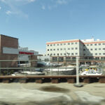 View of Central Maine Medical Center in Lewiston, Maine from the parking lot under blue sky.