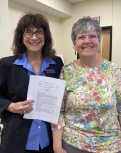 The Sponsor of LD1883 and Maine AllCare chair present the bill at the Maine State House