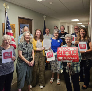 Dr. Julie Pease (in dark blue) representing Maine AllCare
