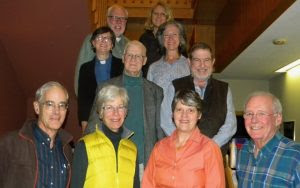 MAC photo - Maine AllCare Board in 2014: (back row) John Newton and Alice Knapp, (2nd row) The Rev. Dr. Suzanne Roberts, Beth Franklin, (center left) Jim Perley and Rep. Charlie Priest, (front left to right) state Senator Geoff Gratwick, Karen Foster, Dr. Julie Pease and Dr. Phil Caper (not pictured, founding member Joe Lendvai)